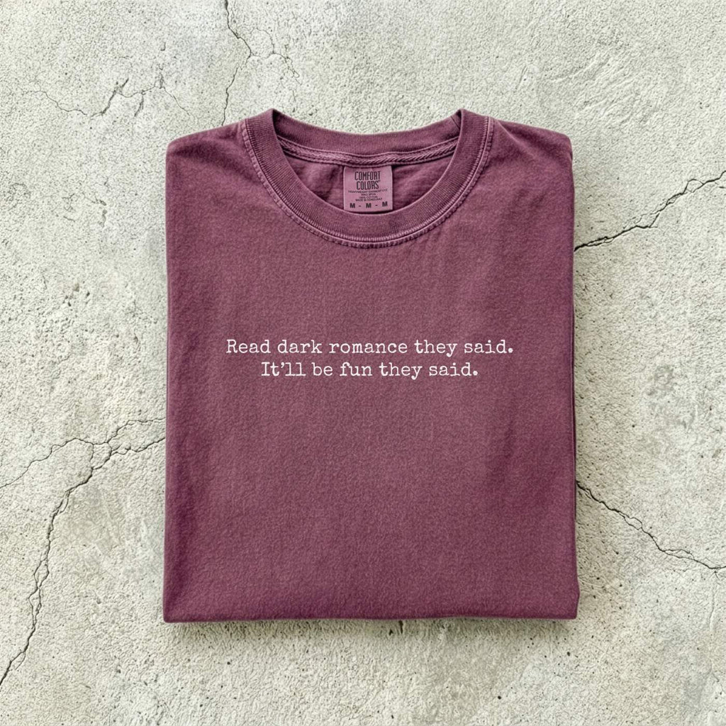 Berry Comfort Colors tee folded flat reading "Read dark romance they said. It'll be fun they said." in a minimal typewriter font.
