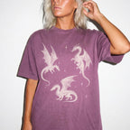 Berry color Comfort Colors 1717 relaxed fit t-shirt with whimsigoth fantasy graphic — three detailed dragon illustrations surrounded by stars and celestial details in off-white line art