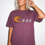 Berry Comfort Colors 1717 relaxed fit tee with pumpkin chasing book ghosts Halloween bookish graphic — front