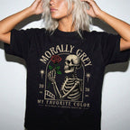 Black color Comfort Colors 1717 relaxed fit t-shirt with dark romance graphic — a skeleton holding a red rose beneath an arch with the text "Morally Grey — My Favorite Color" and the tagline "He is mean to everyone except me"