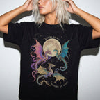 Black Comfort Colors 1717 relaxed fit tee with colorful dragon moon riders by day readers by night romantasy graphic