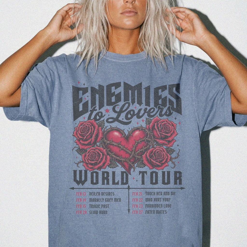 Blue Jean Comfort Colors 1717 relaxed fit tee with Enemies to Lovers World Tour heart and roses dark romance graphic — front