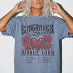 Blue Jean Comfort Colors 1717 relaxed fit tee with Enemies to Lovers World Tour heart and roses dark romance graphic — front