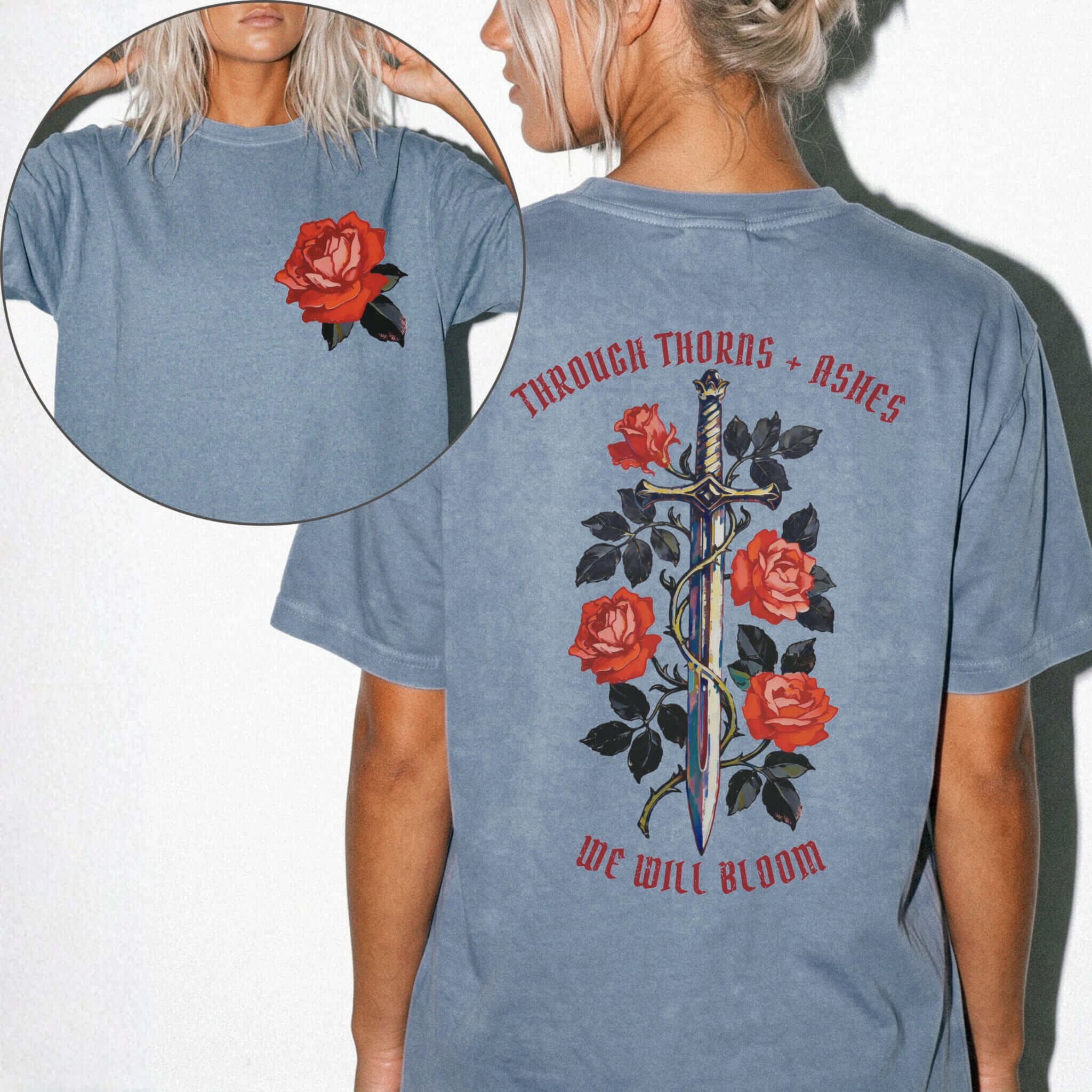Comfort Colors 1717 Blue Jean relaxed fit tee with painterly red rose pocket print on front and ornate sword wrapped in roses with red gothic text 'Through Thorns + Ashes We Will Bloom' on back