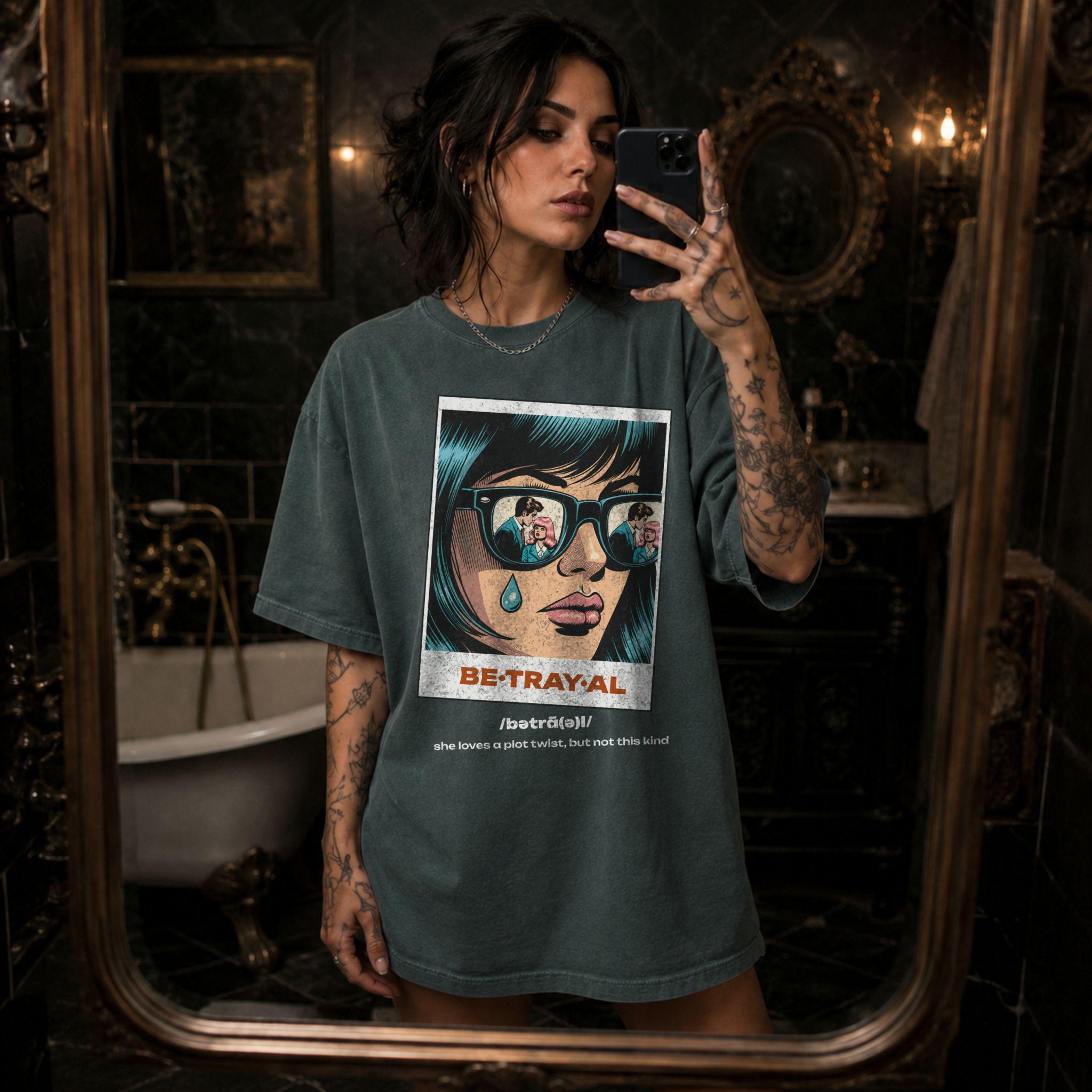 Blue Spruce Comfort Colors 1717 relaxed fit t-shirt with retro pop art graphic — a woman with teal hair and sunglasses reflecting a couple, a single tear on her cheek, with the word BE·TRAY·AL (betrayal) and the tagline "she loves a plot twist, but not this kind" 