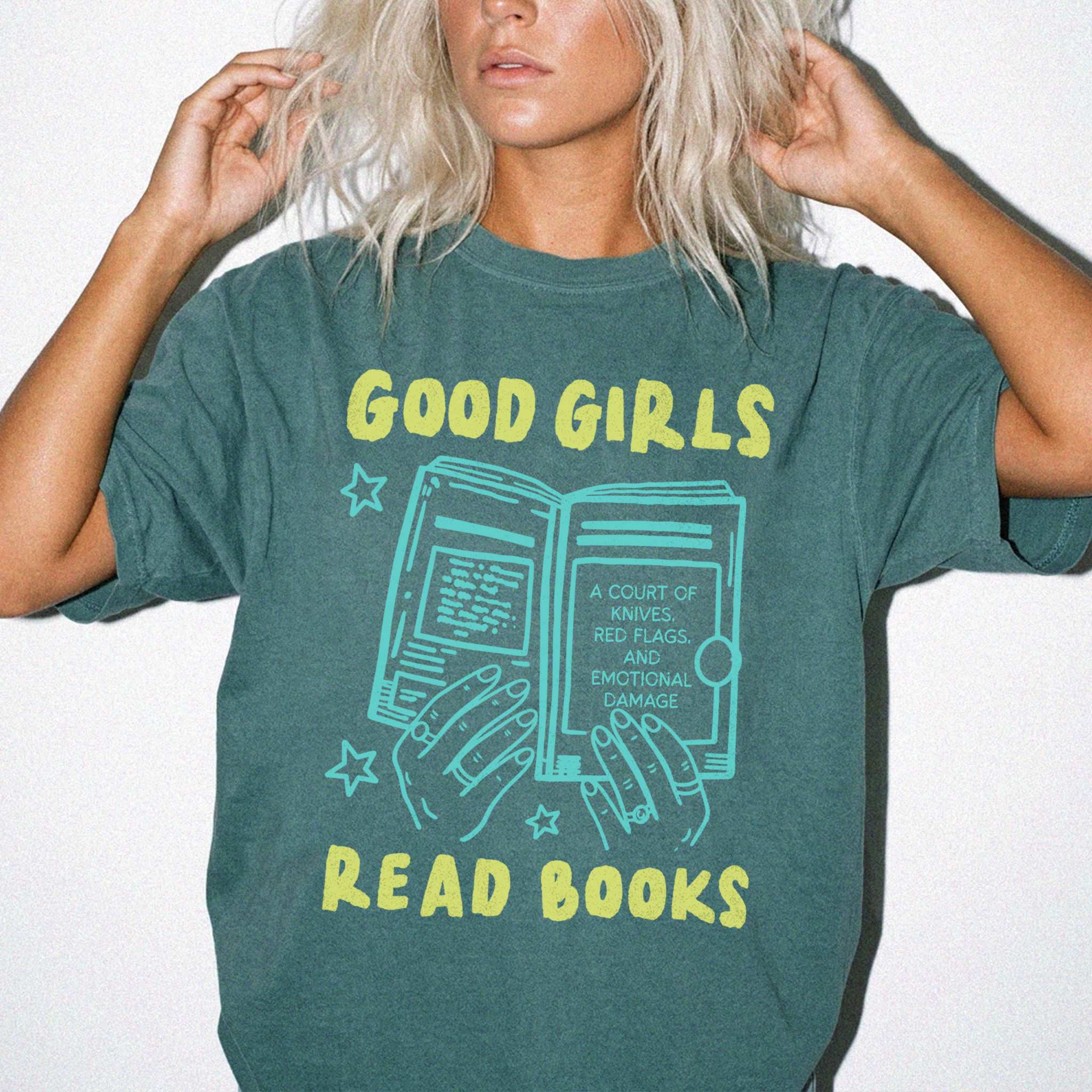 Blue Spruce color Comfort Colors 1717 relaxed fit t-shirt with Y2K retro doodle graphic — hands holding an open book titled "A Court of Knives, Red Flags, and Emotional Damage" with the text "Good Girls Read Books" above and below
