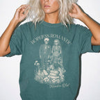 Hopeless Romantic Readers Club Tee in Blue Spruce – vintage-style Comfort Colors graphic tee for dark romance readers. Graphic features a skeleton couple on their wedding day.