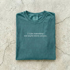 Blue Spruce Comfort Colors tee folded flat reading "I like romantasy and maybe three people." in a typewriter font.