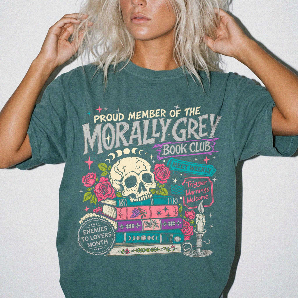 Morally Grey Book Club dark romance bookish tee in Blue Spruce color by Comfort Colors, featuring skull, roses, and stacked books graphic with enemies to lovers and trigger warnings text.