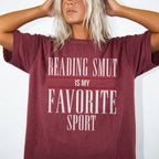 Reading Smut Is My Favorite Sport Tee in Brick – vintage-style Comfort Colors graphic tee for dark romance and romantasy readers