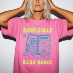 Crunchberry color Comfort Colors 1717 relaxed fit t-shirt with Y2K retro doodle graphic — hands holding an open book titled "A Court of Knives, Red Flags, and Emotional Damage" with a blue book illustration and the text "Good Girls Read Books" above and below