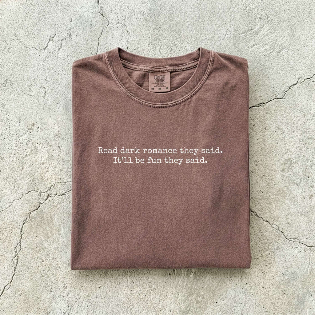 Espresso Comfort Colors tee folded flat reading "Read dark romance they said. It'll be fun they said." in a minimal typewriter font.