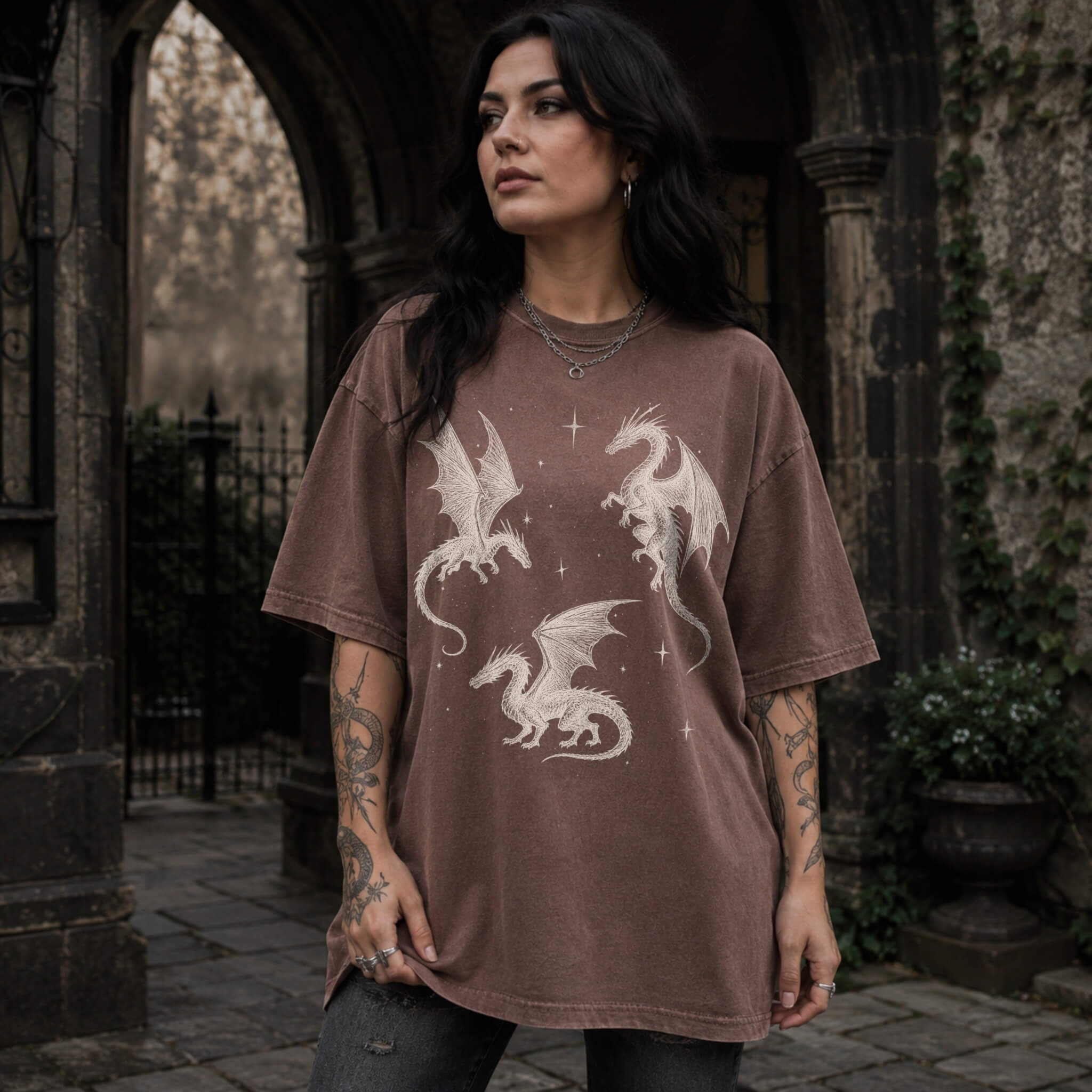 Espresso color Comfort Colors 1717 relaxed fit t-shirt with whimsigoth fantasy graphic — three detailed dragon illustrations surrounded by stars and celestial details in off-white line art