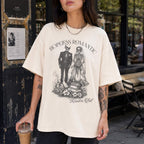 Hopeless Romantic Readers Club Tee in Ivory – vintage-style Comfort Colors graphic tee for dark romance readers. Graphic features a skeleton couple on their wedding day.