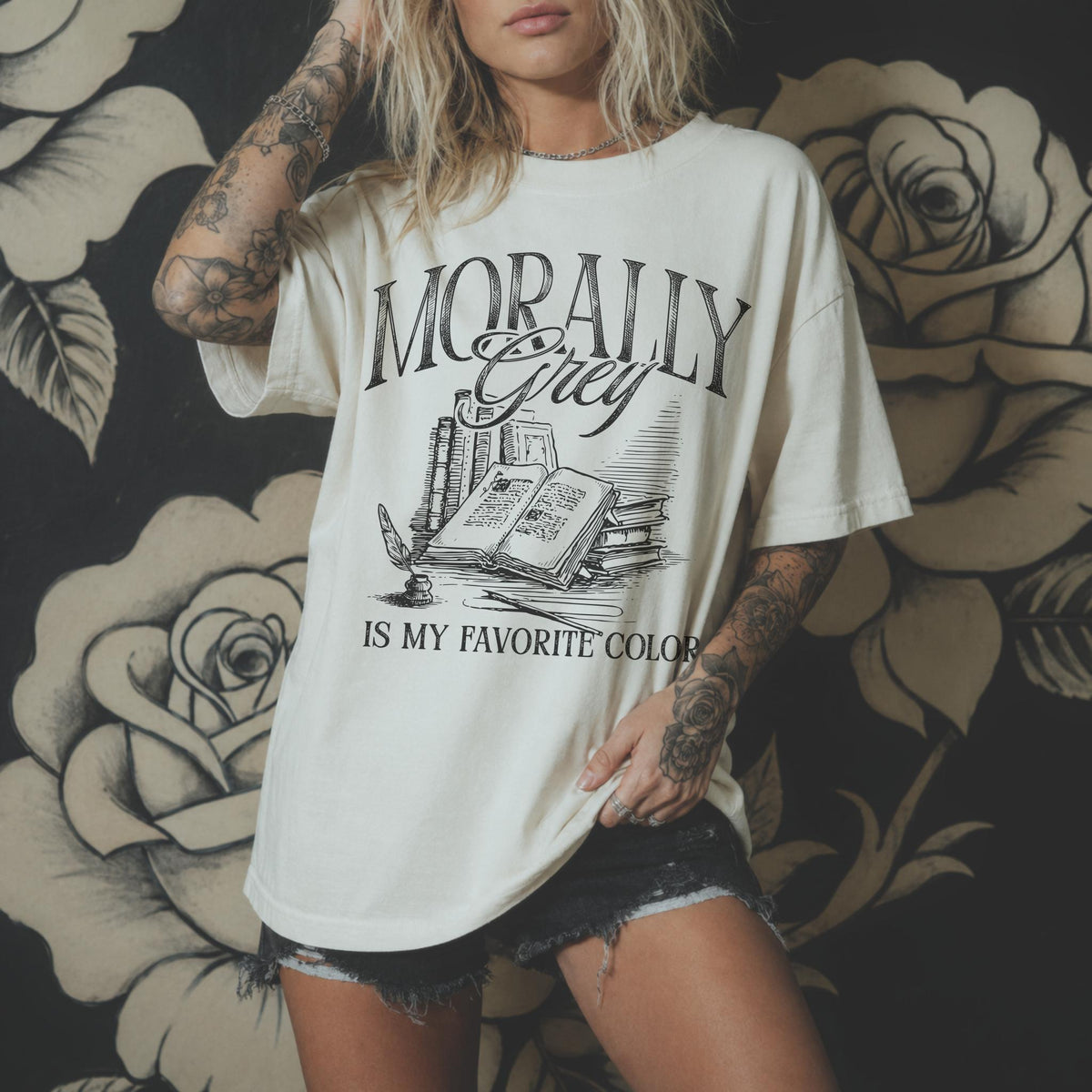 Morally Grey Is My Favorite Color dark academia design on an ivory color tee from Comfort Colors with vintage stacked books and quill graphic.