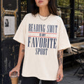 Reading Smut Is My Favorite Sport Tee in Ivory – vintage-style Comfort Colors graphic tee for dark romance and romantasy readers