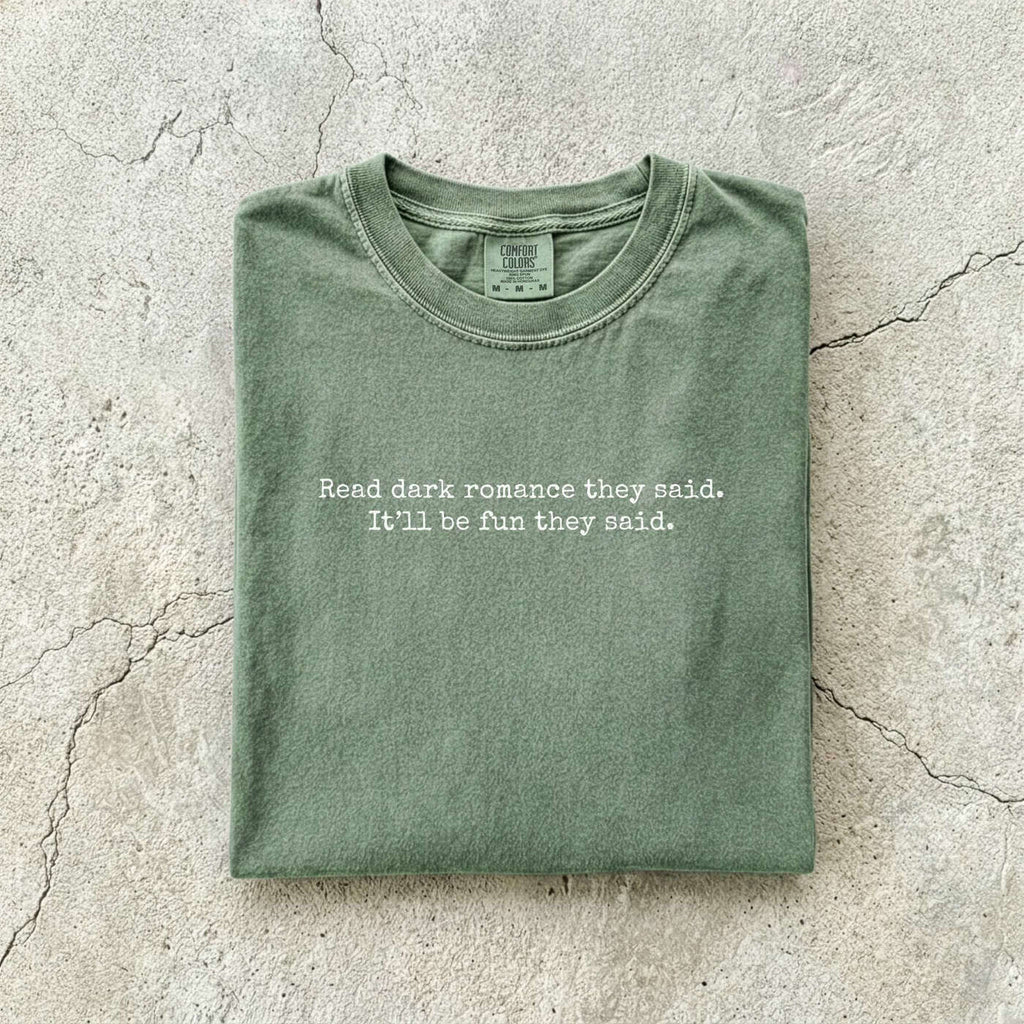 Moss Comfort Colors tee folded flat reading "Read dark romance they said. It'll be fun they said." in a minimal typewriter font.
