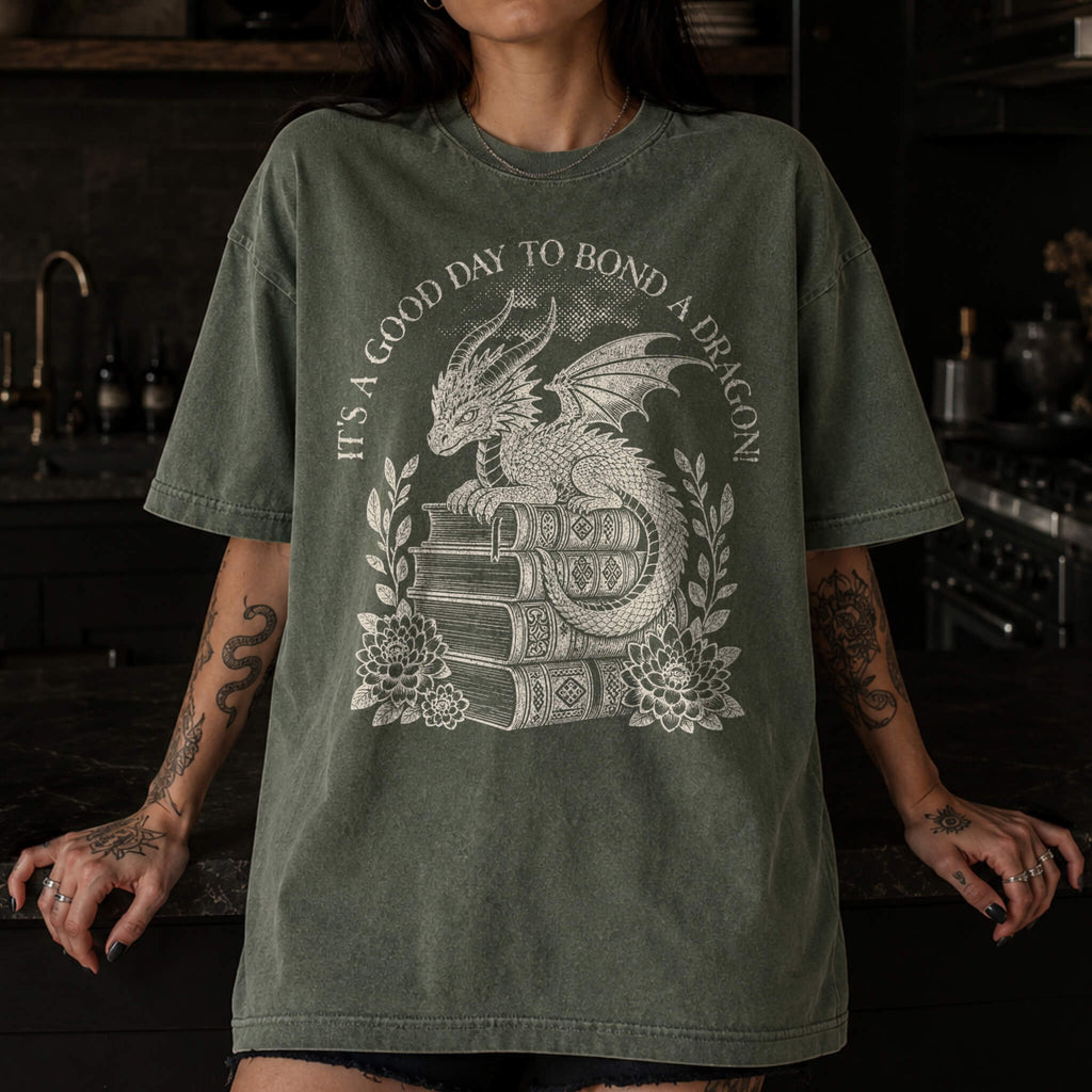It's a Good Day to Bond a Dragon Tee in Moss – vintage-style Comfort Colors graphic tee for fantasy and romantasy readers