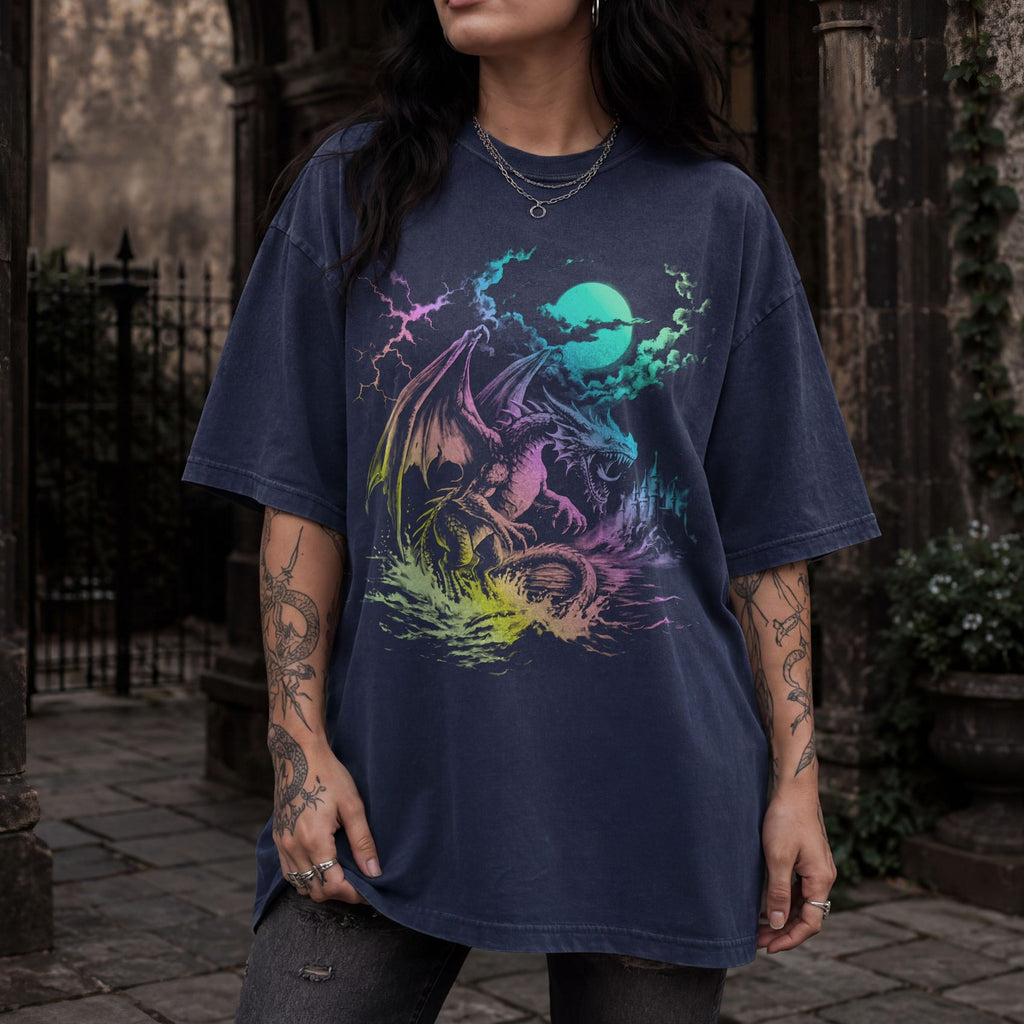 Dragon Moonlight retro 90s fantasy romantasy tee in navy color Comfort Colors, featuring neon-inspired synthwave dragon graphic with moonlit castle and lightning.