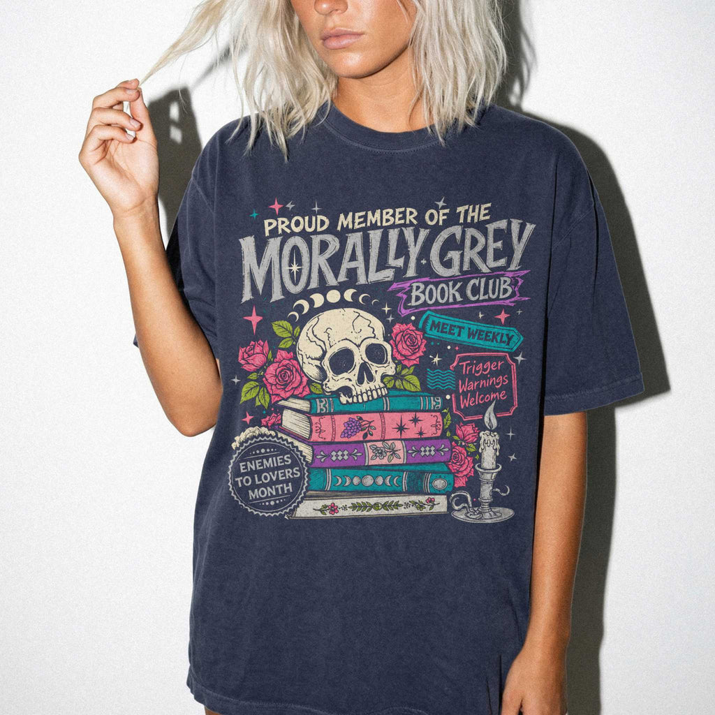 Morally Grey Book Club dark romance bookish tee in Navy color by Comfort Colors, featuring skull, roses, and stacked books graphic with enemies to lovers and trigger warnings text.