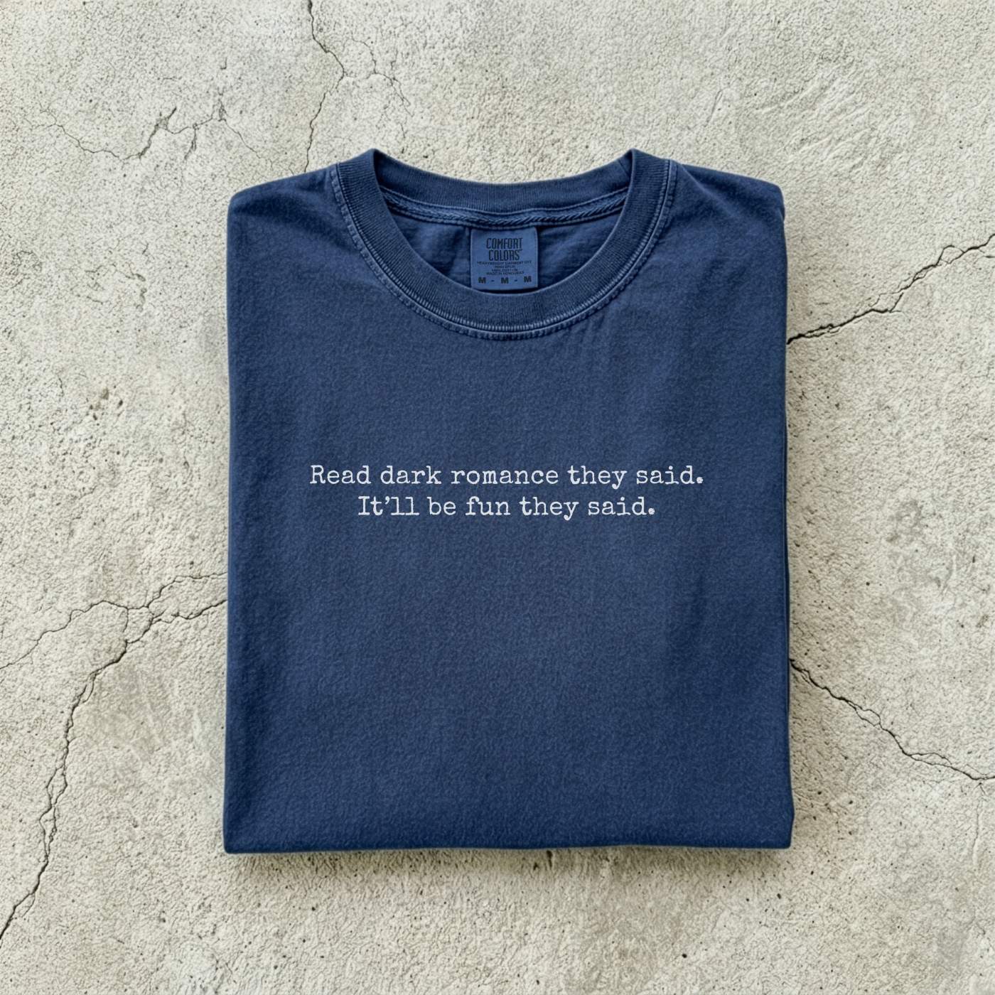 Navy Comfort Colors tee folded flat reading "Read dark romance they said. It'll be fun they said." in a minimal typewriter font.