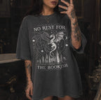 Pepper color Comfort Colors 1717 relaxed fit t-shirt with gothic romantasy graphic — two dragons soaring over a castle beneath moons and celestial details, with the text "No Rest for the Bookish"