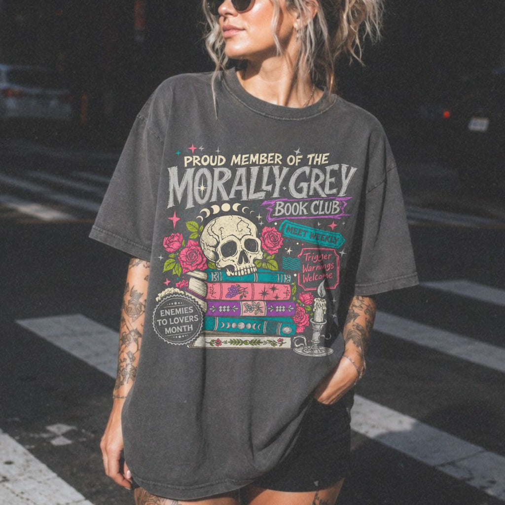 Morally Grey Book Club dark romance bookish tee in pepper color by Comfort Colors, featuring skull, roses, and stacked books graphic with enemies to lovers and trigger warnings text.