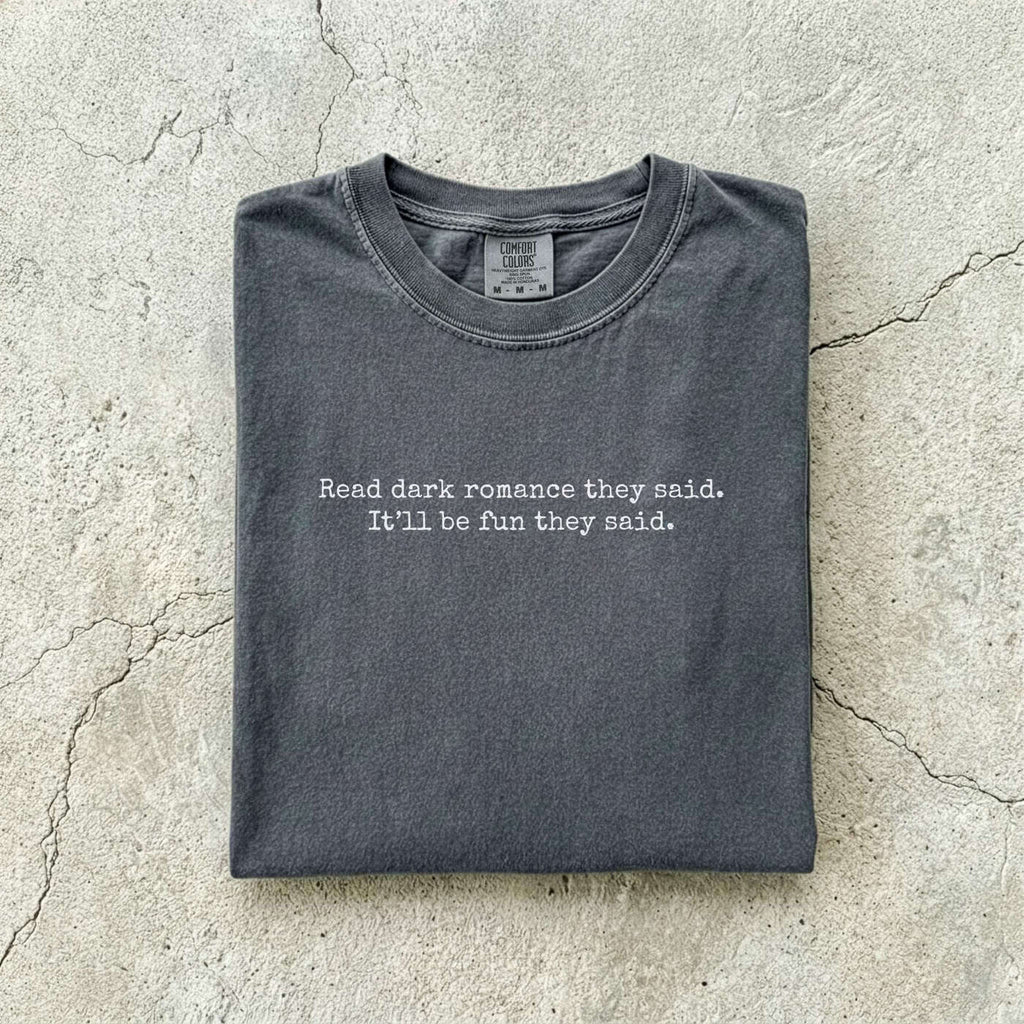 Pepper Comfort Colors tee folded flat reading "Read dark romance they said. It'll be fun they said." in a minimal typewriter font.