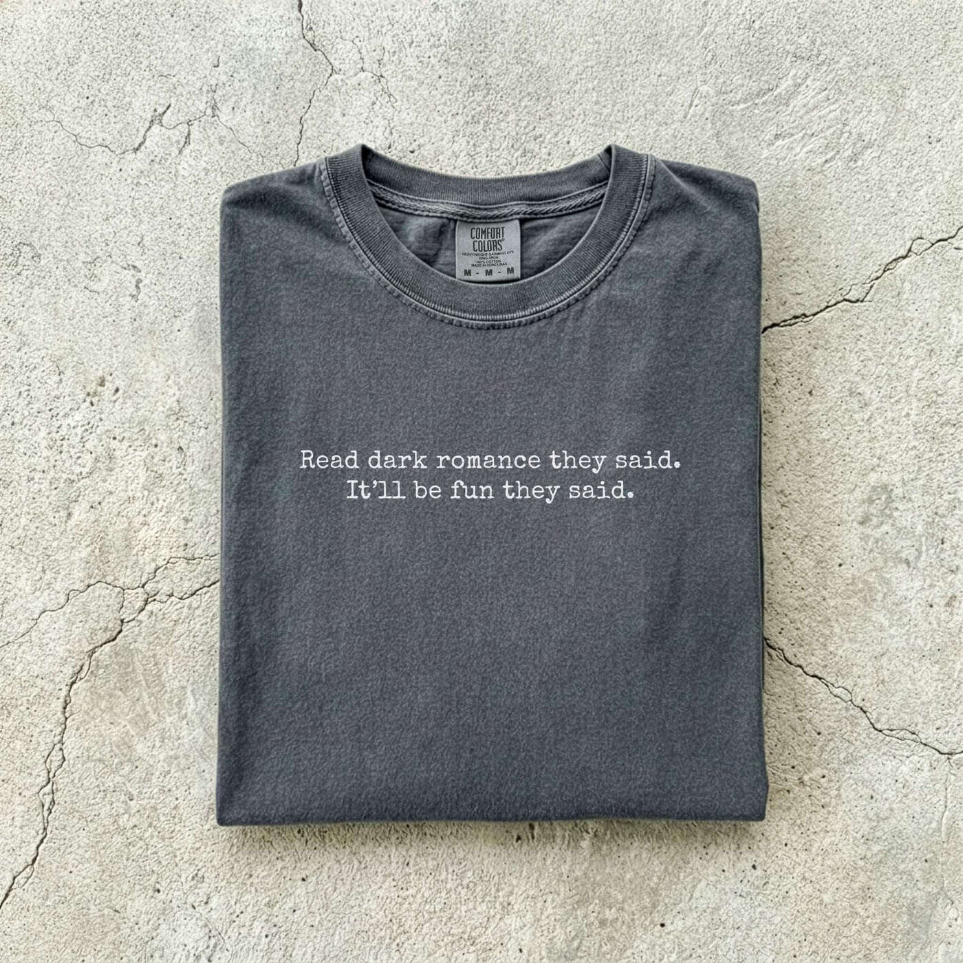 Pepper Comfort Colors tee folded flat reading "Read dark romance they said. It'll be fun they said." in a minimal typewriter font.