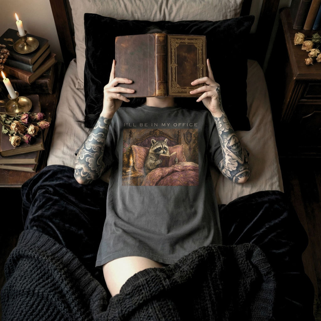 Pepper Comfort Colors 1717 relaxed fit tee with oil painting style raccoon reading in elegant bedroom and I'll Be In My Office text