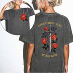 Comfort Colors 1717 Pepper relaxed fit tee with painterly red rose pocket print on front and ornate sword wrapped in roses with gold gothic text 'Through Thorns + Ashes We Will Bloom' on back