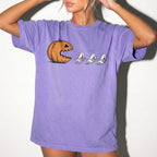 Violet Comfort Colors 1717 relaxed fit tee with pumpkin chasing book ghosts Halloween bookish graphic — front