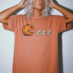 Yam Comfort Colors 1717 relaxed fit tee with pumpkin chasing book ghosts Halloween bookish graphic — front